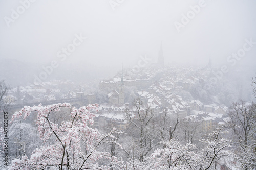 oldtown of Bern in misty snow during cherry blossom © schame87