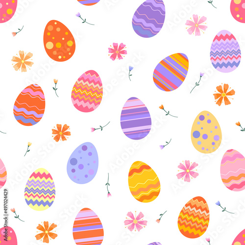 Easter spring seamless pattern. Bright colorful Easter eggs and spring flowers and herbs.