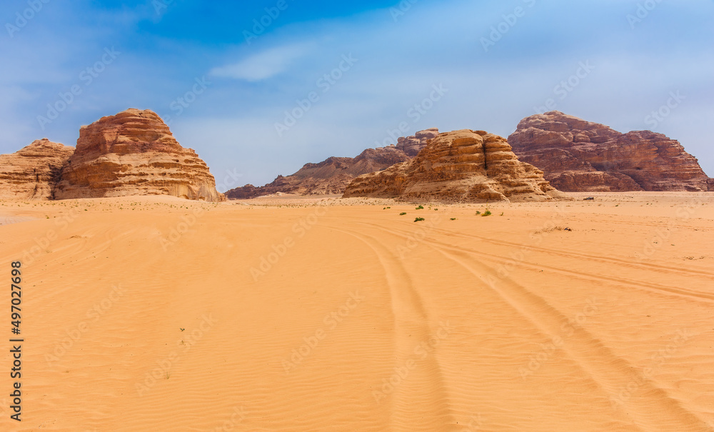 Sands and mountains of Wadi Rum desert in Jordan, beautiful daytime landscape Sands and mountains of Wadi Rum desert in Jordan, beautiful daytime landscape