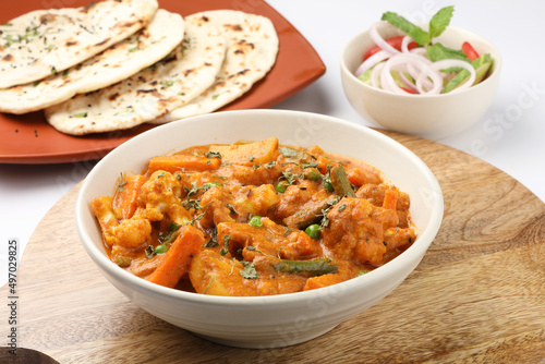 Indian food Mix vegetable curry with Tandoori roti or nan, Indian flat bread photo