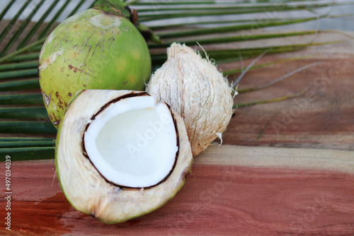Green coconut and milk  on wood table