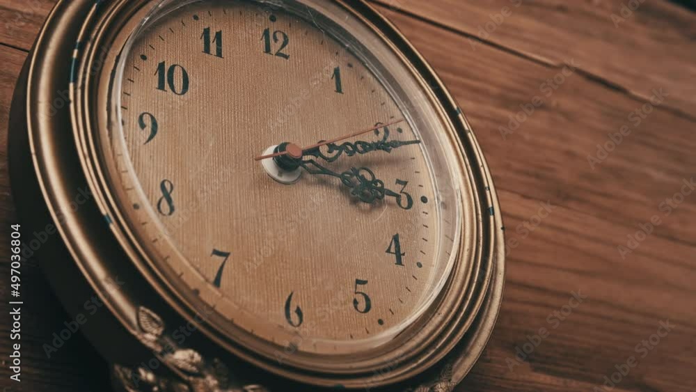 Vintrage Wall Clock with Moving Second Hand on Wooden Background. Old