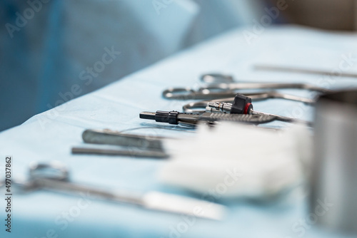 Sterile medical instruments prepared for surgery on the table