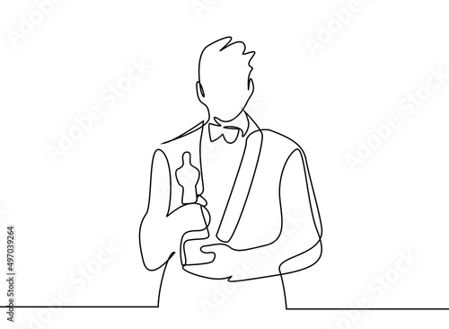 a famous person receives and holds an award at an awards ceremony