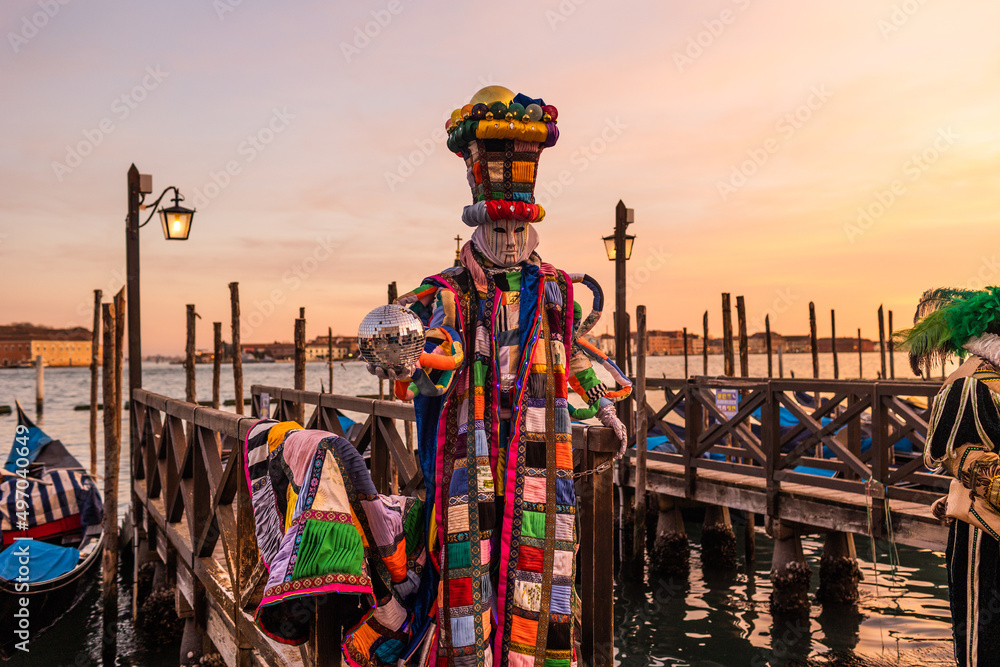 Photography Incredible and colourful sunset in Venice during Venice Carnival - a person in m