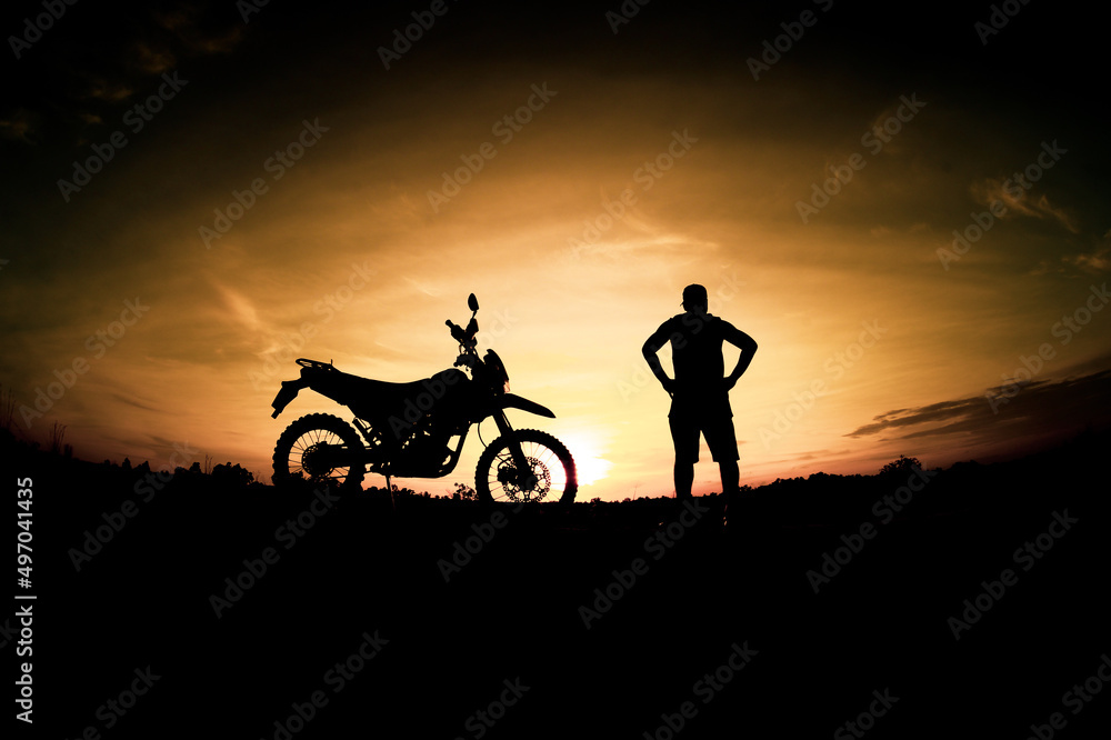 Men's silhouettes and touring motocross bikes. Park to relax in the mountains in the evening. adventure travel and leisure concept
