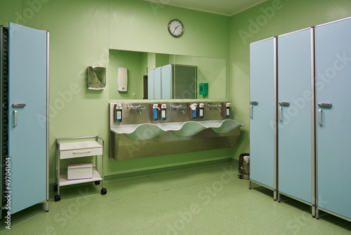 sinks in the operating room with disinfectant soap for hand disinfection before surgery and lockers for personal belongings of doctors
