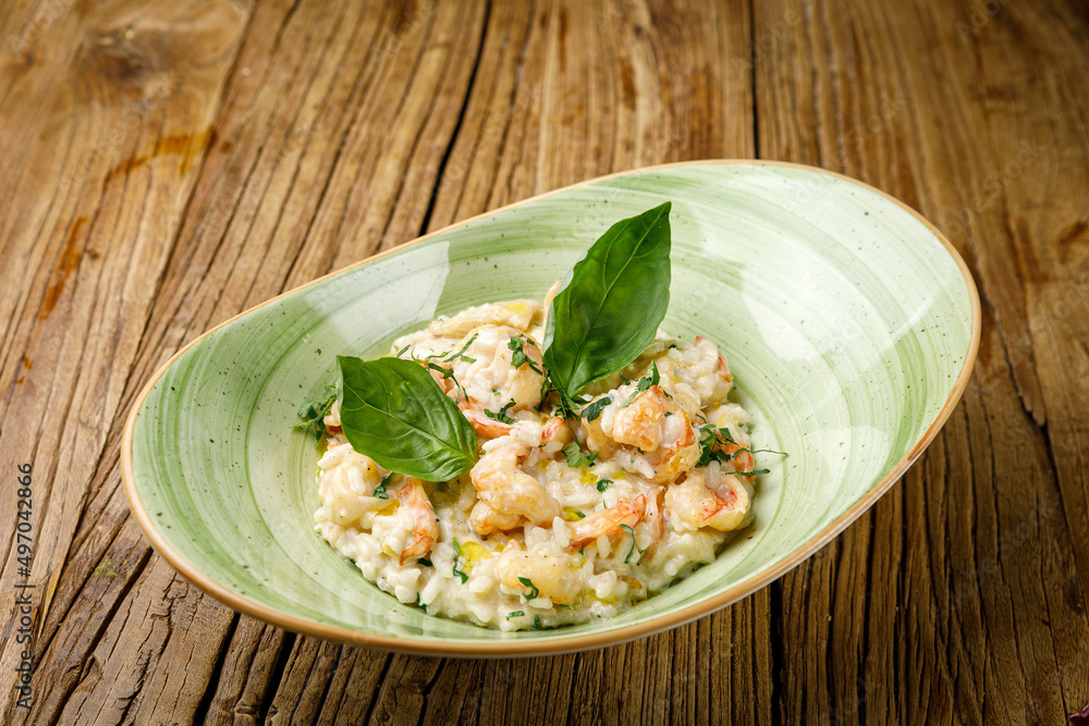 risotto with vegetables on a wooden table
risotto with vegetables on a wooden table
