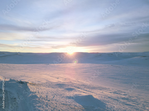 Sunset in a snowy desert