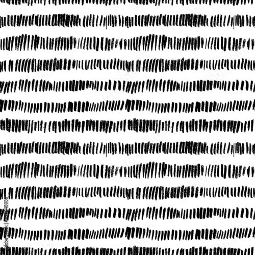 Vector black short lines seamless pattern. Hand drawn tiny brush strokes. Vertical grunge dash stains. Abstract simple geometric background. Memphis style background with small dashes, retro texture