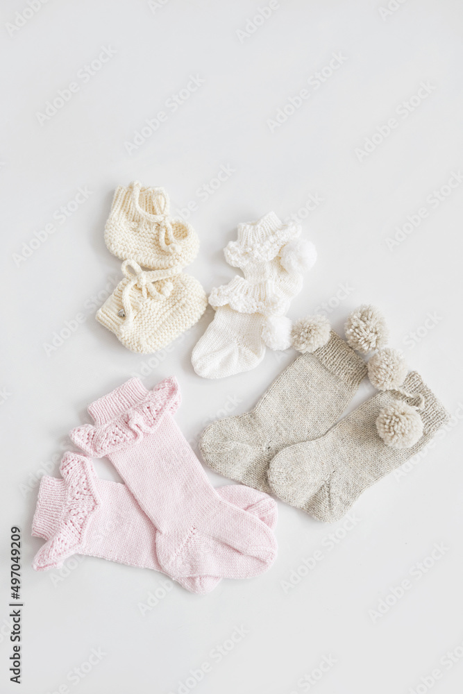 Knitted socks, kids clothes and accessories for knitting. Needlework and knitting. Hobbies and creativity. Knit for children. Handmade. Hobbies and creativity Knitted socks, kids clothes and accessories for knitting. Needlework and knitting. Hobbies and creativity. Knit for children. Handmade. Hobbies and creativity