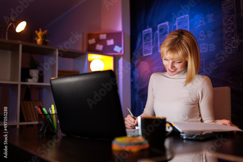 Woman working overtime doing paperwork