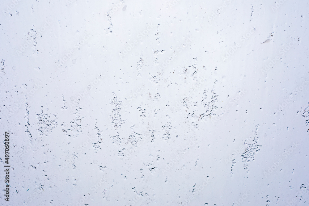 abstract background of wet snow drops on glass, horizontal abstract background of wet snow drops on glass, horizontal