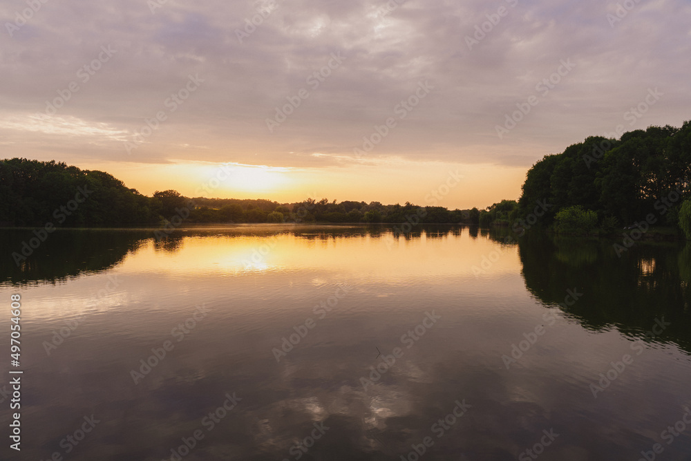 Sunset on the coast of the lake. Natural landscape. Nature of Northern Europe. reflection. landscape during sunset.