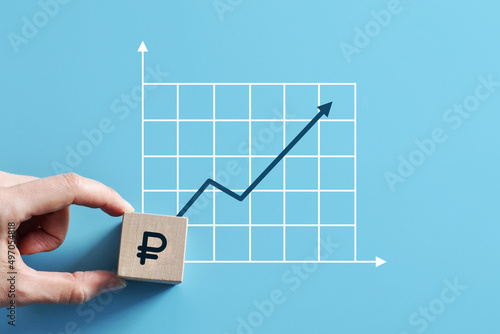The ruble icon and the upward growth chart. Symbol of the growth of the ruble exchange rate