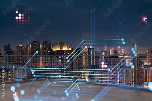 Rooftop with concrete terrace, Kuala Lumpur night skyline. Hi tech digital holograms to optimize business process by applying new technologies. City downtown. Double exposure.