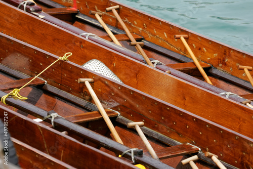 wooden dragon boats and paddles photo