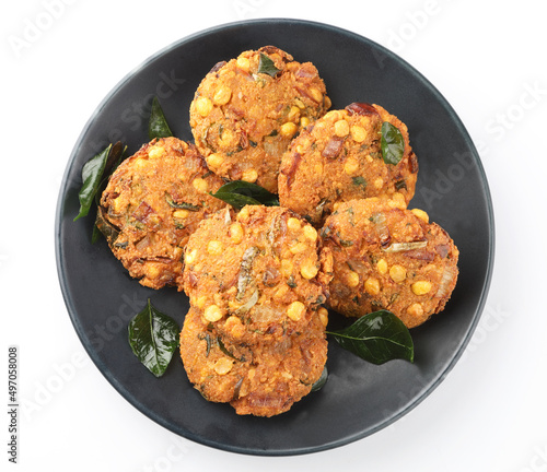Tea time snack, Dal Vada or Parippu Vada or Paruppu Vadai , deep fried snacks savory food from Kerala fried in coconut oil. photo