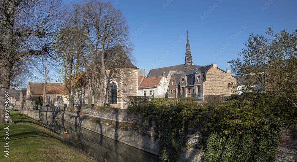 Tongeren. Belgium. Canal and citywall. Church.