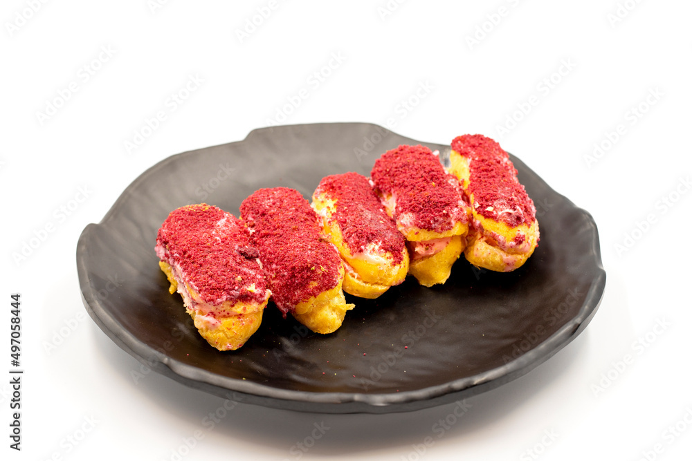 Raspberry eclair cake isolated on white background. World cuisine delicacies. close up Raspberry eclair cake isolated on white background. World cuisine delicacies. close up