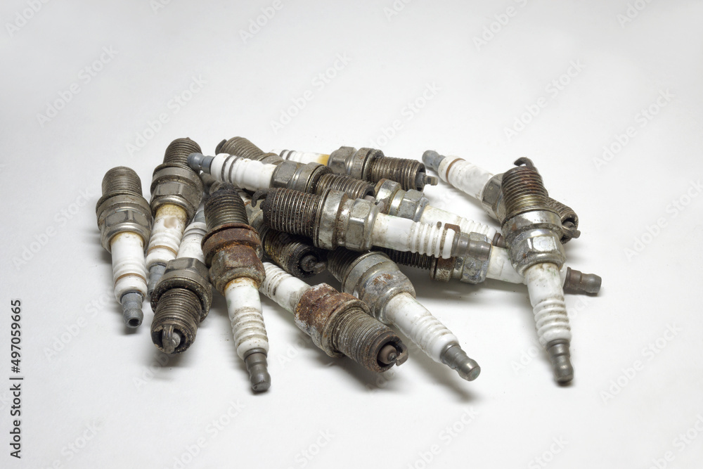 used copper spark plugs on white background. spark plugs big heap, old used copper spark plugs on white background. spark plugs big heap, old