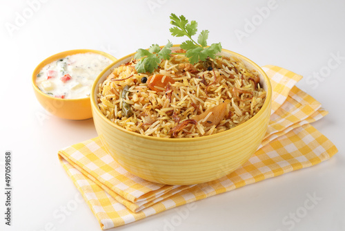 Vegetable Biryani a flavorful Indian rice dish with peas, carrots and potatoes with spicy spices. selective focus photo