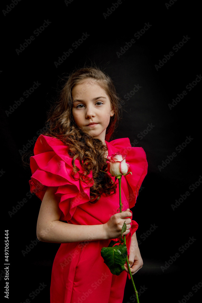 girl, dressed in a bright pink outfit, on a black background girl, dressed in a bright pink outfit, on a black background