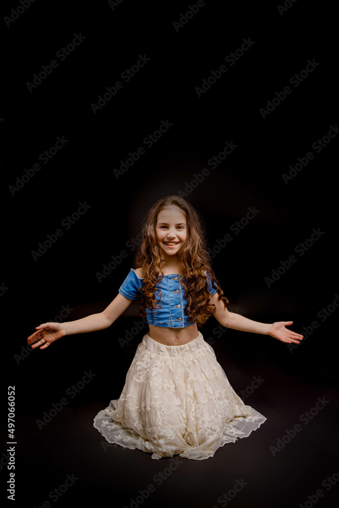 girl dressed in an outfit for dancing, on a black background girl dressed in an outfit for dancing, on a black background
