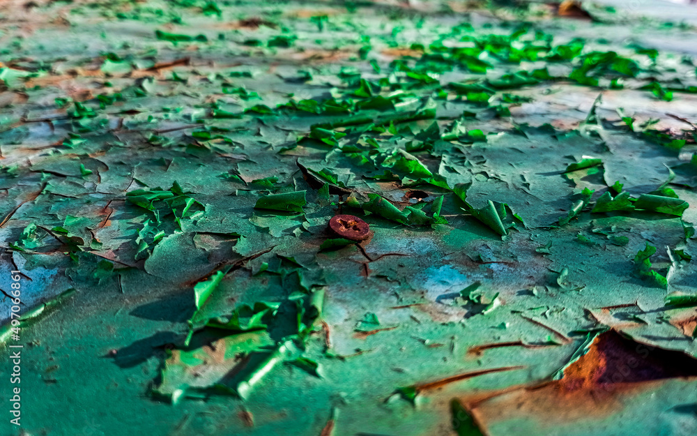 Macro photo of the texture of shabby green paint on a metal surface Macro photo of the texture of shabby green paint on a metal surface