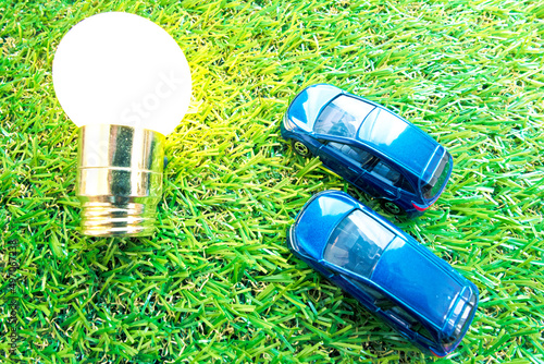 Wallpaper Mural grass and light bulb and 2 cars Torontodigital.ca