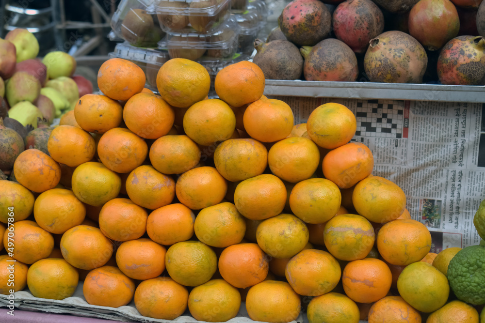 Heap of orange in the market. Closeup Orange at market. Deep yellow color orange. ripe orange.