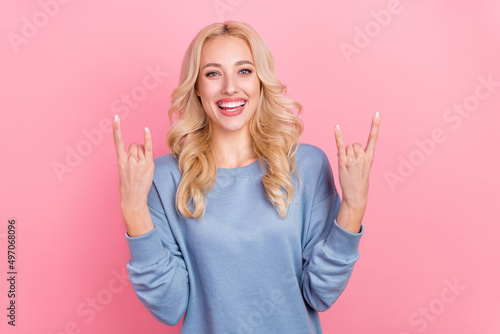 Photo of young pretty girl show fingers rock symbol heavy punk swag isolated over pink color background