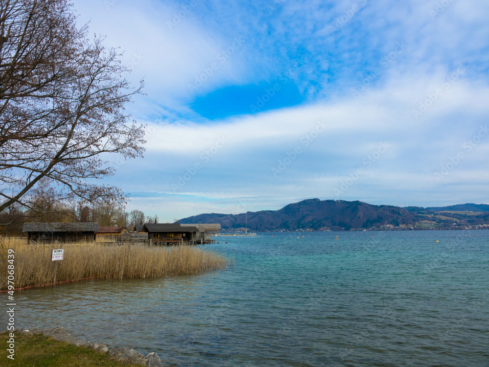 Attersee in Salzkammergut in Austria. Beautiful natural beach with reeds and stilt huts. Upper Austria, Europe.