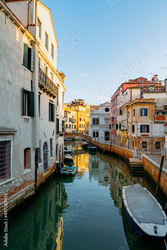 Venice  Italy - July 28 2021  Narrow canals with boats and gondolas in Venice  Italy