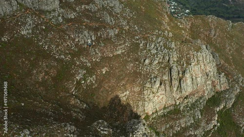 Drone Shot Of Cable Car Traveling Over Table Mountain In Cape Town, South Africa. 