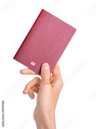Canvas Print Hand holding passport isolated on white background