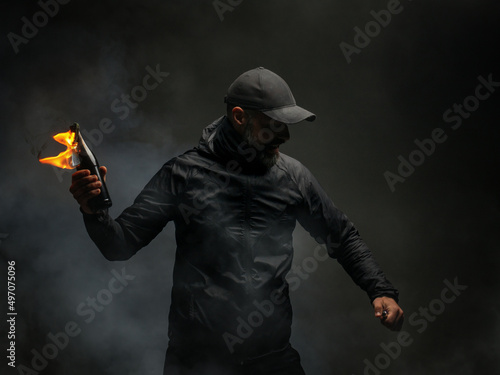 Cuadro en lienzo emotional portrait of a man with a molotov cocktail in his hands