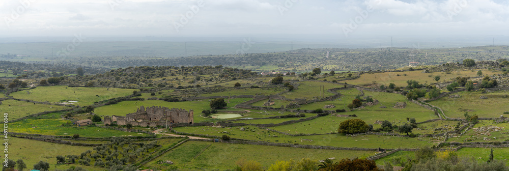 panorama landscape view of old rock walls and fields in the oak landscape of Extremadura