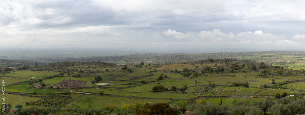 panorama landscape view of old rock walls and fields in the oak landscape of Extremadura
