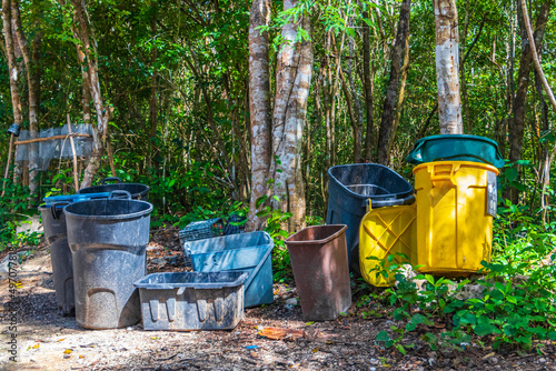 Trash waste garbage cans in the jungle in Mexico.