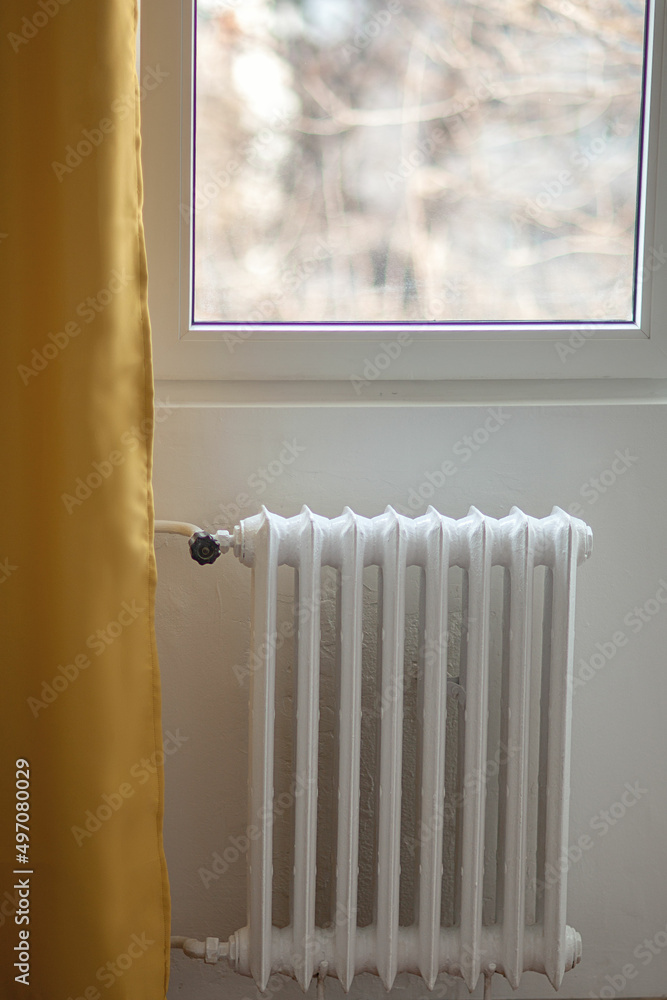 custom made wallpaper toronto digitalwhite battery on the wall. Iron radiator against the background of a white wall and yellow curtains