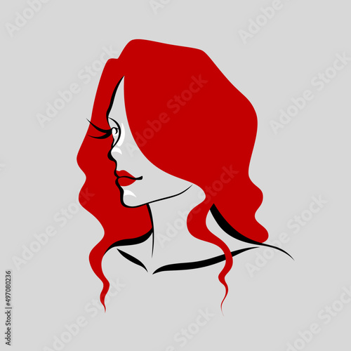 Beautiful woman with red hair is looking away.