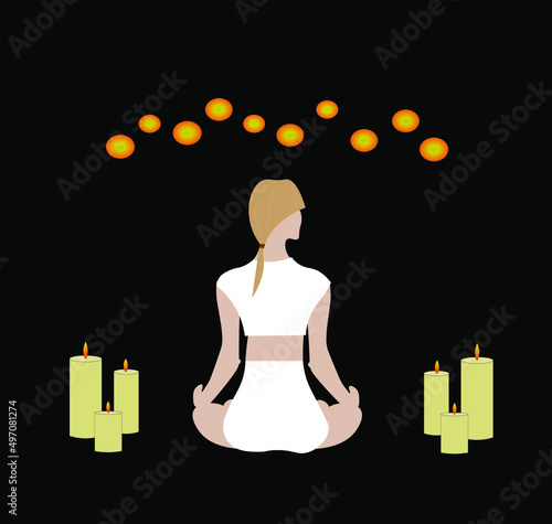 meditating girl practicing candlelight yoga on a black background