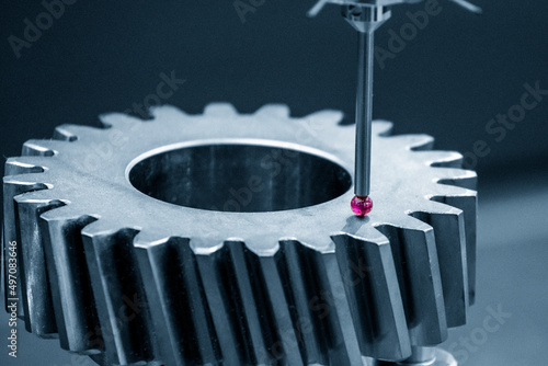 Foto Closeup scene the CMM machine  measuring the bevel gear part .