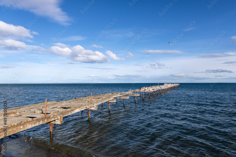 Old and rusty wooden pier in Punta Arenas, Chile