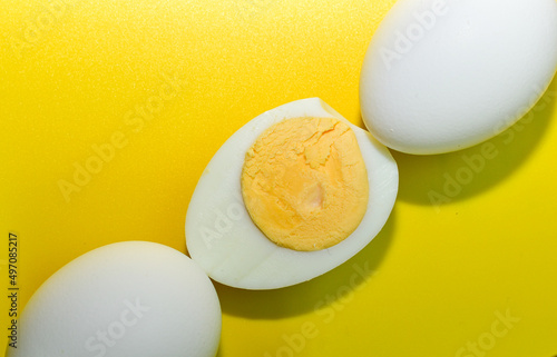 composition of chicken eggs on a yellow background. Top view. Close-up