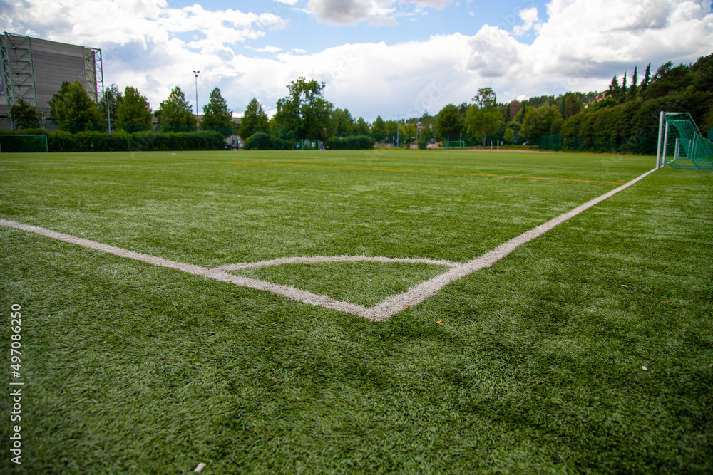 Fototapeta premium Empty football field from corner line perspective 