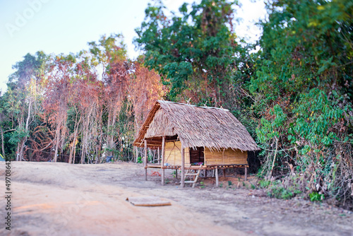 Thatched-roofed hut located near the coast.