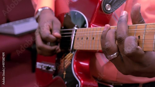 Male musician playing the guitar.