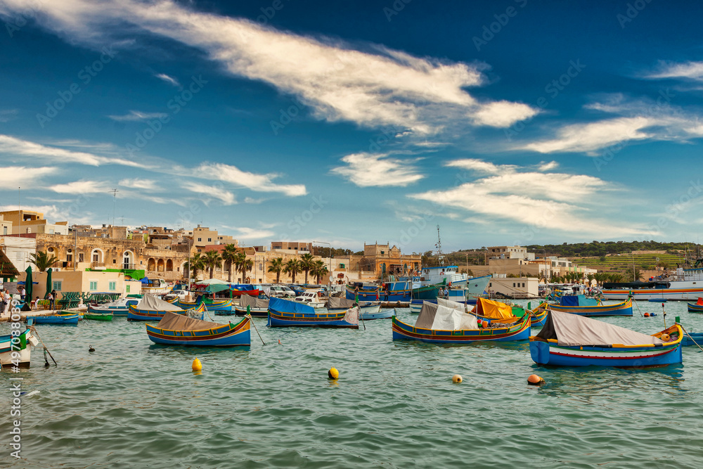Marsaxlokk harbor with multicoloured boats Malta